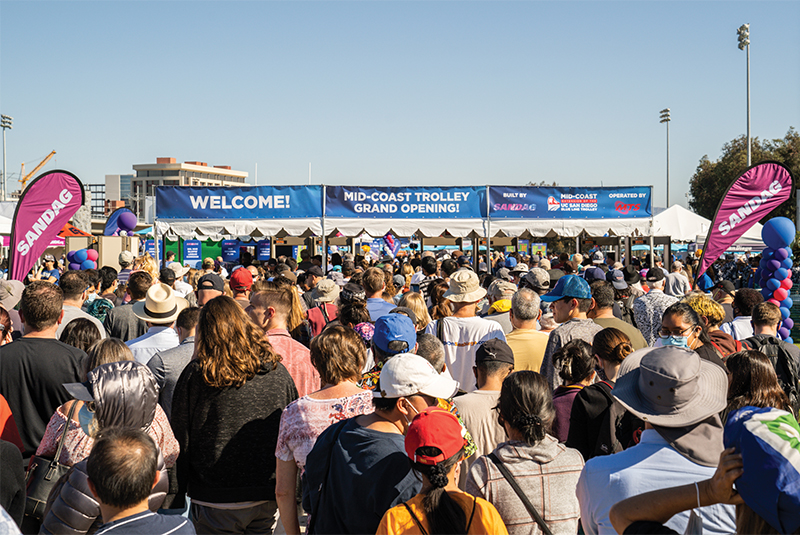 Crowds gather at the entrance to the Mid-Coast Trolley Grand Opening Celebration