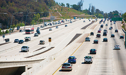 Southbound I-15 freeway showing traffic in both south- and northbound directions with the express lanes in the center.